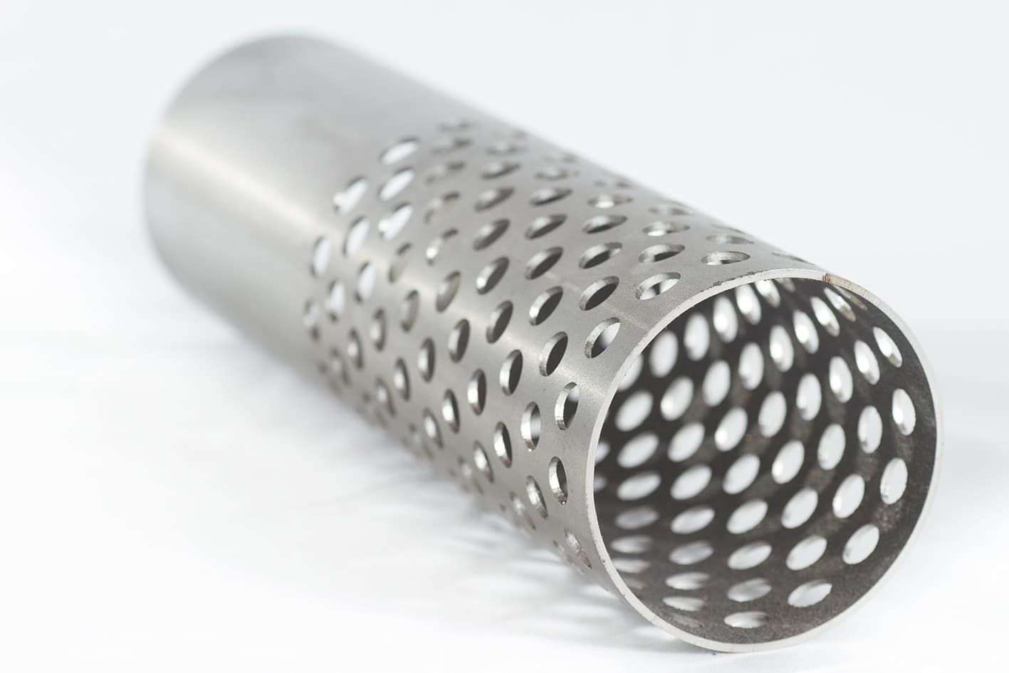 Stainless steel tube with staggered round perforations made by laser cutting