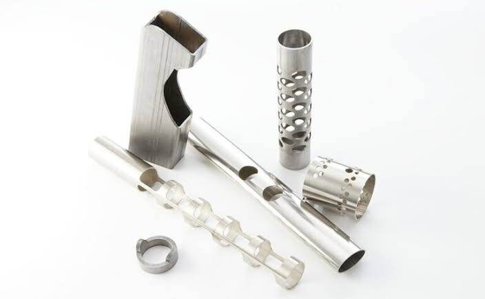 Laser-cut stainless steel tube parts with custom windows, slots and perforations